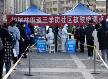 COVID-19 cases have more than doubled in China’s growing outbreak