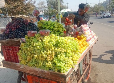 Indian fruit seller making good money in Nepal